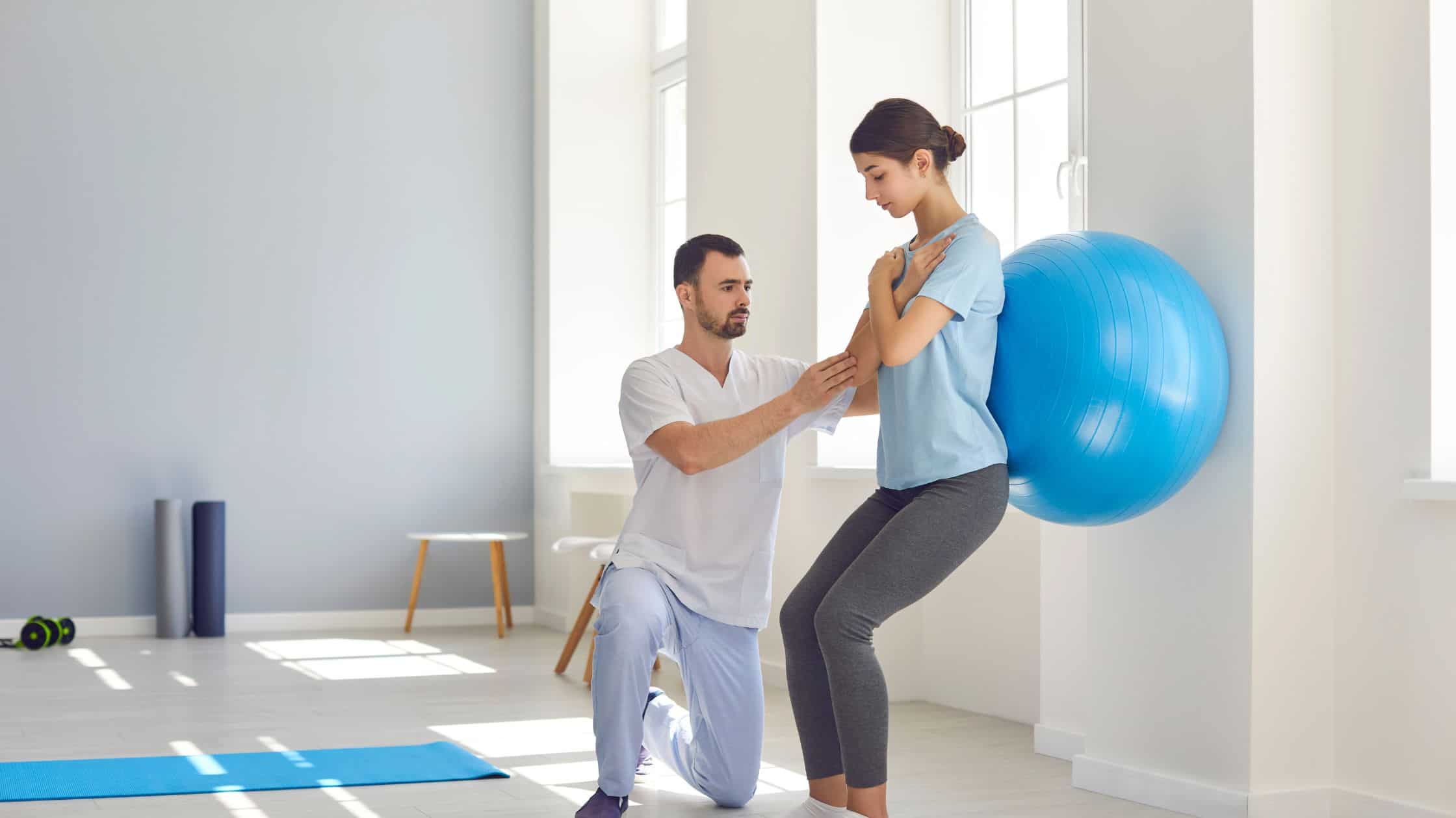 a woman strengthening her back with physical therapy. 